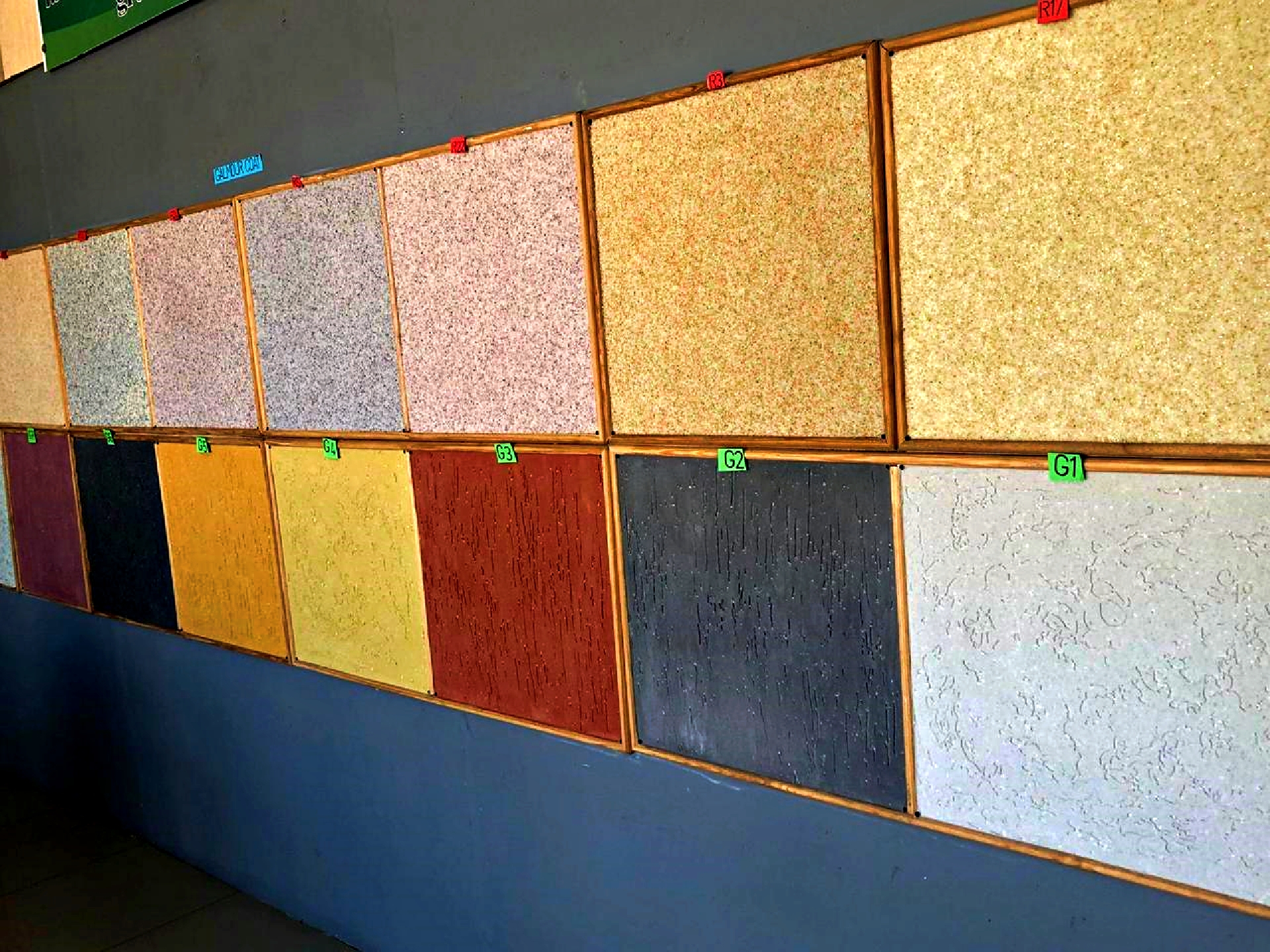 Wall coating colour swatch display showing Gamazene (G series) and Glamour Coat (R series) colour samples in multiple tones
